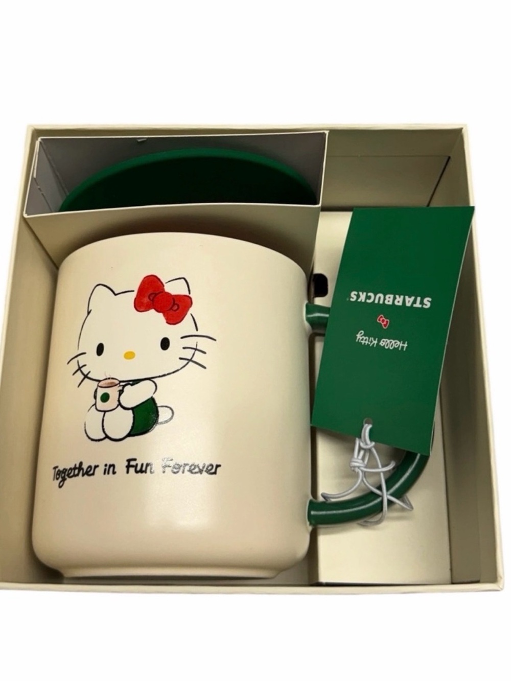 Starbucks Cream Hello Kitty Mug with Green Handle and Red Bow